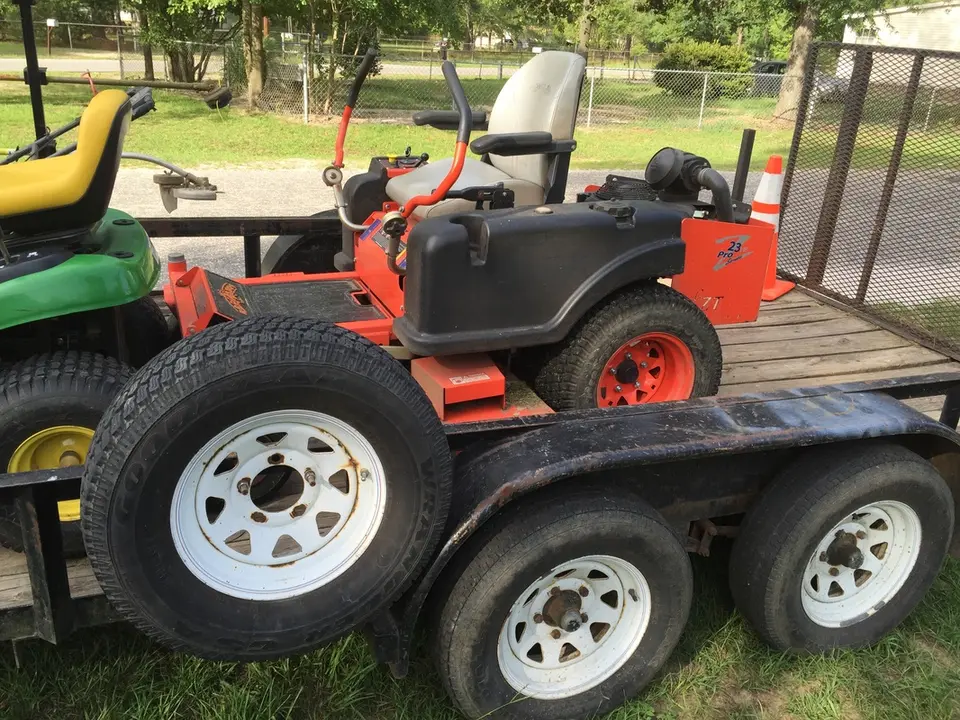 Zero-turn mower on a trailer